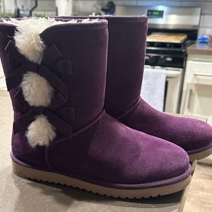 8.5 Purple Kookaburra boots.